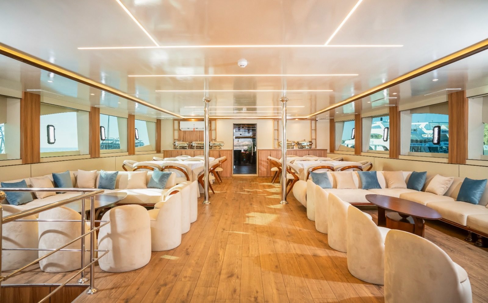 Main saloon with soft lounge seating and sea windows