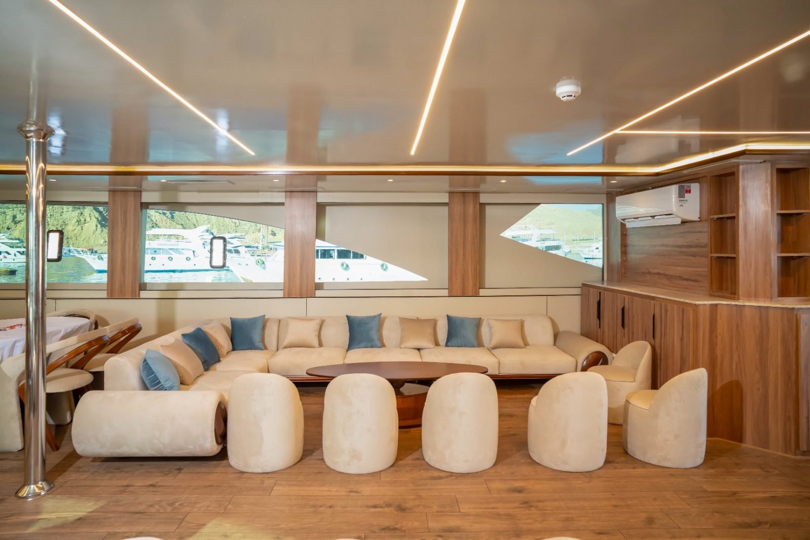 Main saloon with soft lounge seating and sea windows
